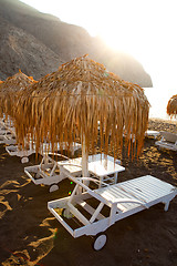 Image showing Sunbeds in Perissa, Santorini, Greece