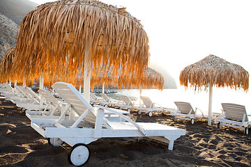 Image showing Sunbeds in Perissa, Santorini, Greece