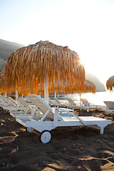 Image showing Sunbeds in Perissa, Santorini, Greece