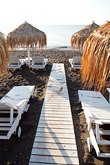 Image showing Sunbeds in Perissa, Santorini, Greece