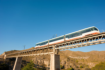 Image showing Train crossing a bridge