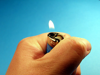 Image showing Lighter in hand