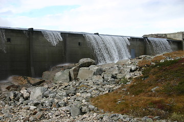 Image showing water flows out of the dam on the Hardangervidda in Norway