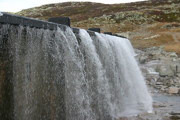 Image showing water flows out of the dam on the Hardangervidda in Norway