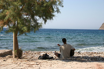 Image showing playing the guitar on the beach Tilos Greece