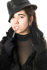 Image showing Portrait of pretty young brunette in gloves with claws