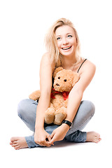 Image showing Cheerful blonde with a teddy bear