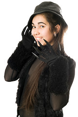 Image showing Smiling girl in gloves with claws. Isolated