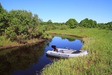 Image showing rubber boat on coast river