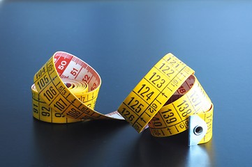 Image showing measuring tape of the tailor