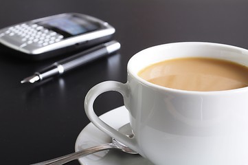 Image showing cup of coffee in the office