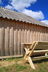 Image showing wooden bench near wooden wall 