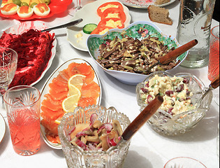 Image showing varied food-stuffs on white tablecloth