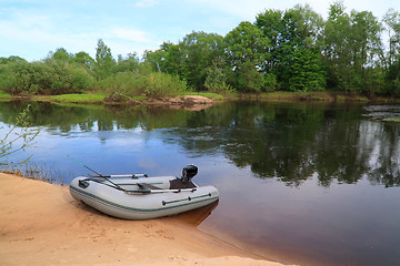 Image showing rubber boat on coast river