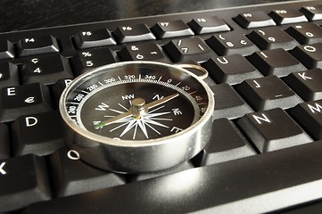 Image showing computer keyboard and compass