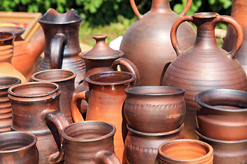 Image showing clay pitchers on rural market