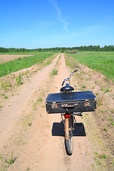 Image showing old valise on old bicycle