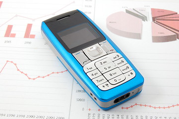 Image showing cell phone over business chart