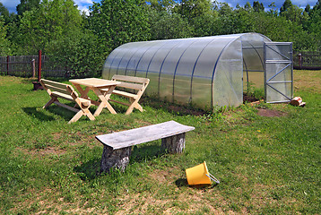 Image showing new bench near plastic of the hothouse