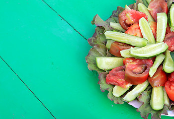 Image showing vegetable salad on green wooden table