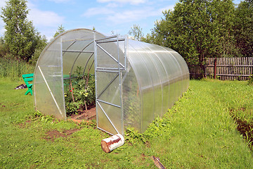 Image showing plastic hothouse in rural homestead