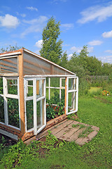 Image showing wooden hothouse in summer garden