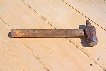 Image showing old gavel on wooden board