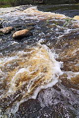 Image showing river flow amongst stone