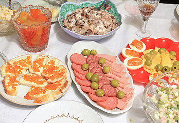 Image showing varied food-stuffs on white tablecloth