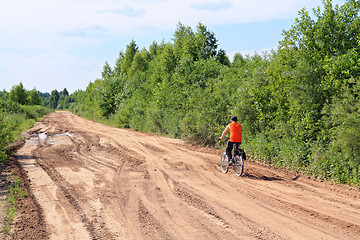 Image showing boy on bicycle on rural road