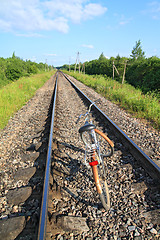 Image showing old bicycle on railway