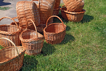 Image showing brown baskets on green herb