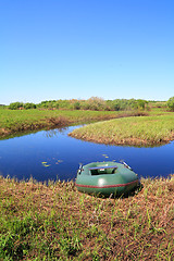 Image showing rubber boat on coast river