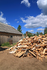 Image showing firewood in courtyard of the rural building