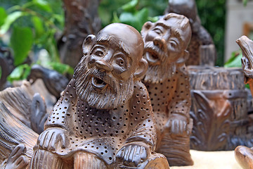 Image showing two wooden toys on green background