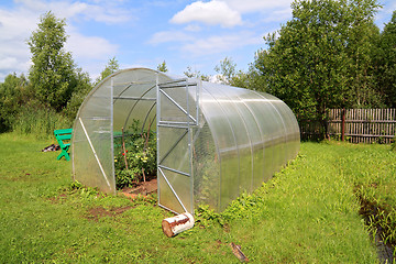 Image showing plastic hothouse in summer garden