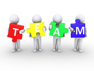 Image showing Men holding team puzzle pieces