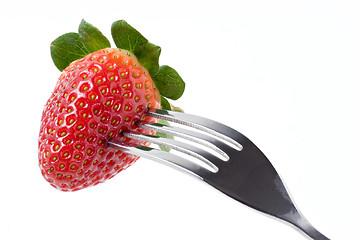 Image showing Strawberry with fork isolated on white