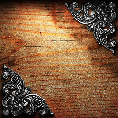 Image showing iron ornament on wood