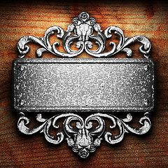 Image showing iron ornament on wood
