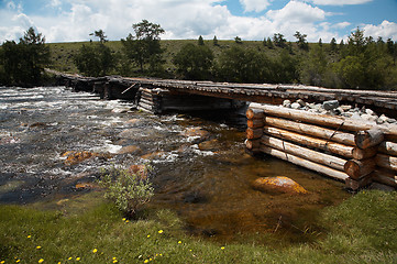 Image showing Wooden bridge over river