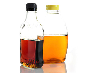 Image showing maple syrup and honey 