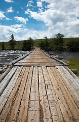 Image showing Wooden bridge over river