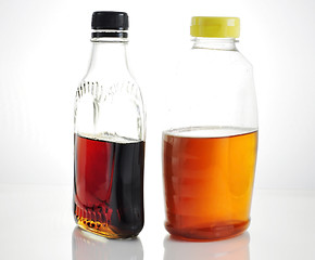 Image showing maple syrup and honey 