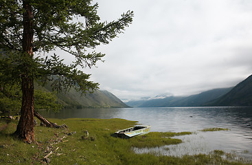 Image showing Boat on the bank of mountain lake