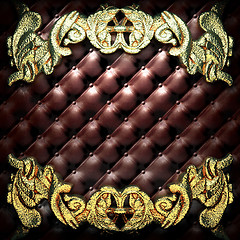 Image showing golden ornament on leather