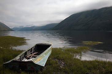 Image showing Boat on the bank of mountain lake