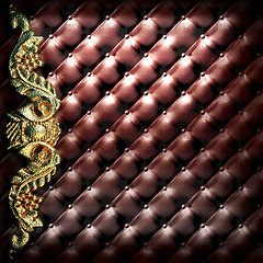 Image showing golden ornament on leather