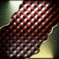Image showing golden plate on leather