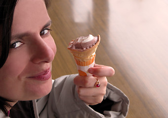 Image showing Smiling woman with icecream